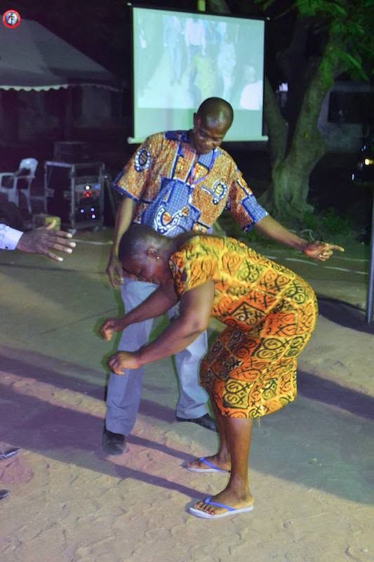 The same man bending to the ground