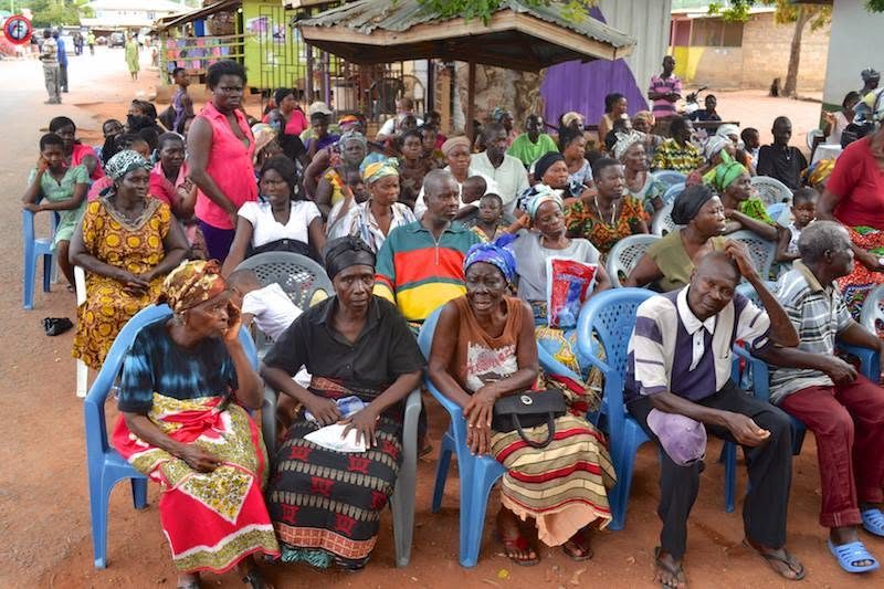 People seated in rows waiting to be seen at the free clinic