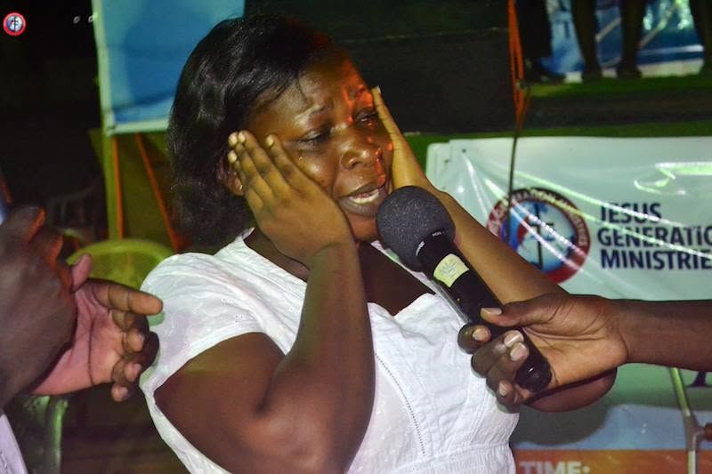 The same woman speaking into the microphone