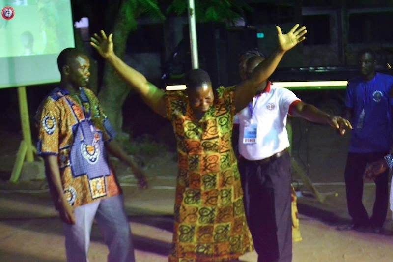 A man with both arms outstretched