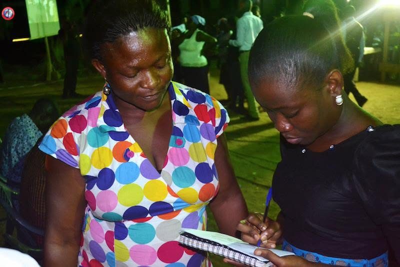 A campaign volunteer taking a patient’s details