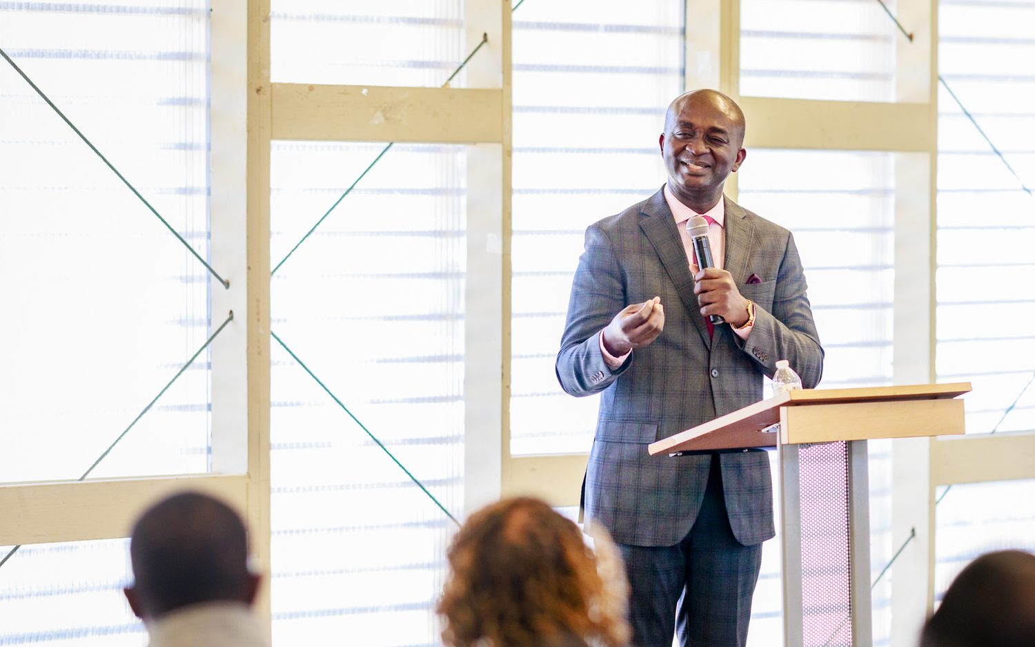 Dr. Boadum teaching to a seated congregation
